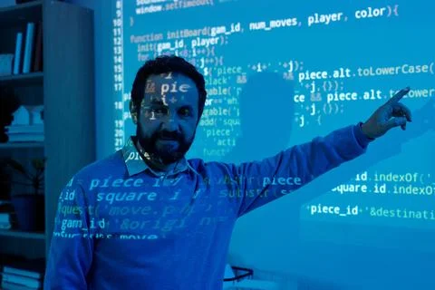 Engineer Creating Code with Projected Computer Screen Stock Photos