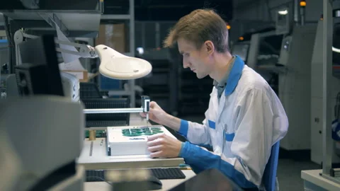 An engineer creating mother boards, close up. Stock Footage 104048098