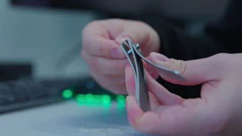 An engineer cutting nails on a workplace while having break Stock Footage 271065063