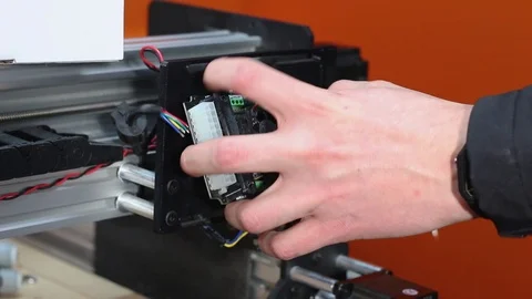 Engineer Cutting Wires And Removing Electrical Board From Workshop Stock Footage 100756990
