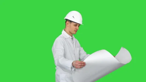 Engineer dancing with a blueprint being in a good mood on a Green Screen, Chroma Stock-Footage 139435230