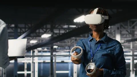 Engineer in data center analyzing performance outputs using virtual reality Stock Photos
