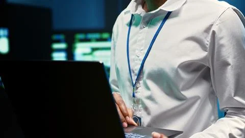Engineer in data center fixing issues Stock Photos