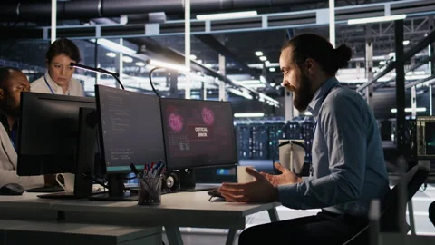 Engineer in data center frustrated by critical error popup on monitor Stock Footage 309637901