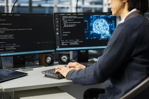Engineer in data center optimizing hardware for artificial intelligence tasks Stock Photos