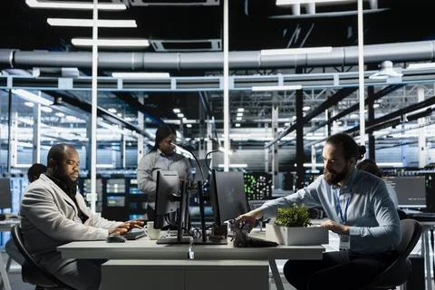 Engineer in data center packing desk items after receiving job termination Stock Photos