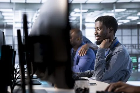 Engineer in data center updating systems to keeps performance up Stock Photos