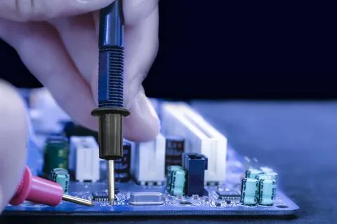 Engineer demonstrates close up how to check Stock Photos