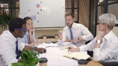 Engineer, designer, architect and builder discussing house project on meeting. Stock Footage 101788447