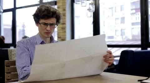 Engineer Designer Checks the Construction Drawings Stock Footage 63863650