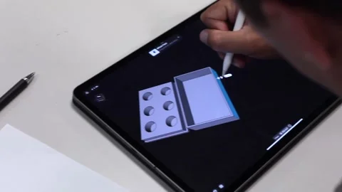Engineer designing 3 dimensional object on tablet Stock Footage 205196177