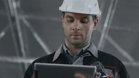 Engineer Designing Work of Machine Manufacture. Male Person in Hardhat or Protec Stock Footage 199475829