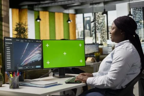Engineer designs eco power line towers on isolated screen computer Stock Photos
