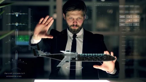 An engineer designs an full electric aircraft using futuristic programs and Stock Footage 149240059