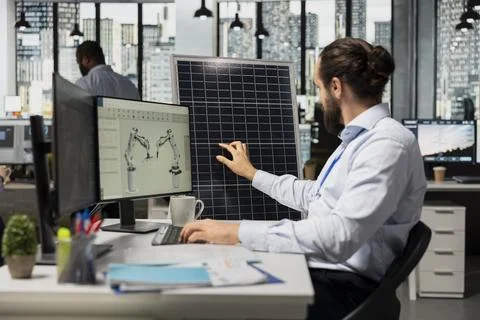 Engineer designs solar panel cells, reducing environmental impact Stock Photos