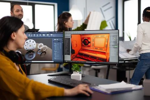 Engineer developer analyzing cad software to develop creative video game Stock Photos