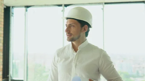 Engineer developer in helmet inspecting building. Builder constructor specialist Stock Footage 201291630