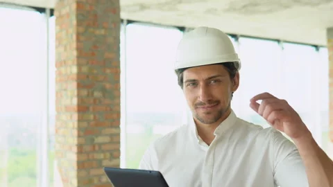 Engineer developer in helmet inspecting building. Builder constructor specialist Stock Footage 201293828