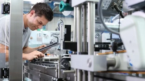 Engineer With Digital Tablet Checking Automated Machine In Factory Stock Footage 93377584