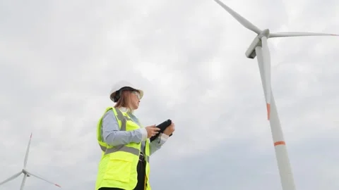 An engineer with a digital tablet develops strategies to increase the Stock Footage 284710778