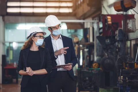 Engineer with digital tablet supervising autonomous producton process Stock Photos