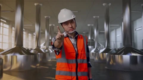 Engineer Disapproving With No Index Finger Sign at Beer Plant Stock Footage 332544373