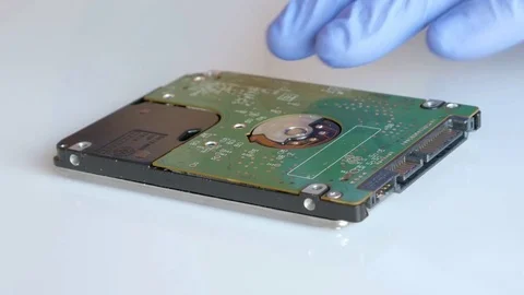 Engineer is disassembling broken hard disk drive for data recovery Stock Footage 72931526