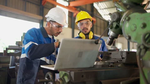 Engineer discuss with team via laptop Stock Footage 171072929