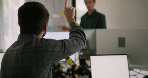 Engineer Discussing Robotics Code During Team Meeting. Stock Footage 306737226