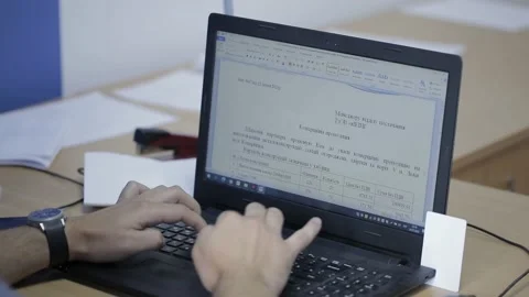 Engineer discussing work with laptop computer at logistics center warehouse Видео 142875577