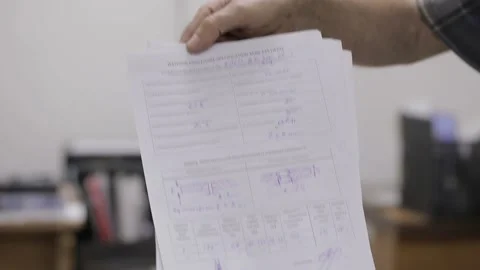 Engineer discussing work with laptop computer at logistics center warehouse Stock Footage 142887229