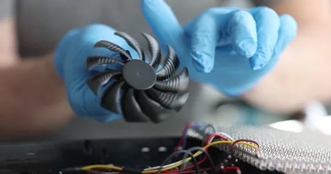 Engineer dismantle cooler cooling fan remove dusty parts Stock Footage 183546077