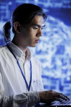 Engineer does AI systems checkup Stock Photos