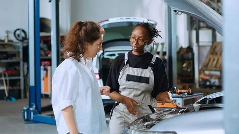 Engineer does car maintenance for client 스톡 사진