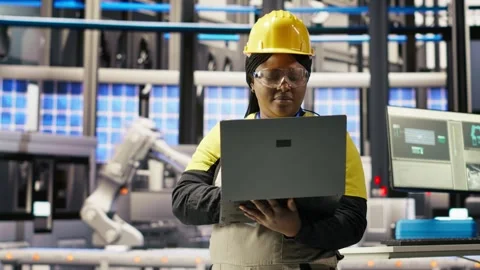 Engineer does predictive maintenance using laptop, analyzing IoT sensor data Stock Footage 308724804