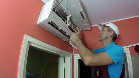 Engineer Doing Air Conditioner Maintenance Stock Footage 69200378
