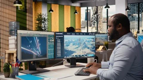 Engineer doing clean energy production technology testing on PC Stock Photos