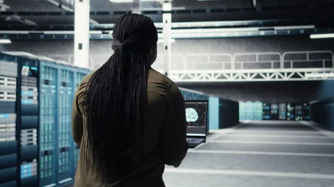 Engineer doing data center automation using AI software tools on laptop Stock Footage 317125717
