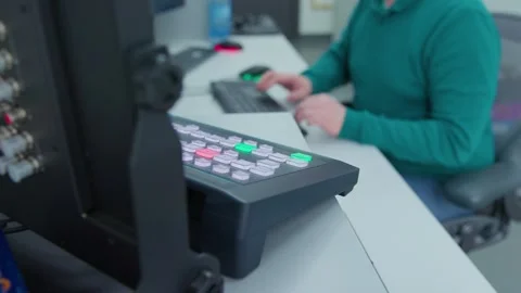 An engineer doing his job in a control room 動画素材 334584031