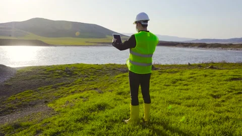 Engineer doing land and water survey. Stock Footage