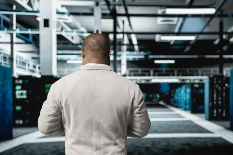 Engineer doing yearly checkup to prolong data center hardware life span Stock Photos