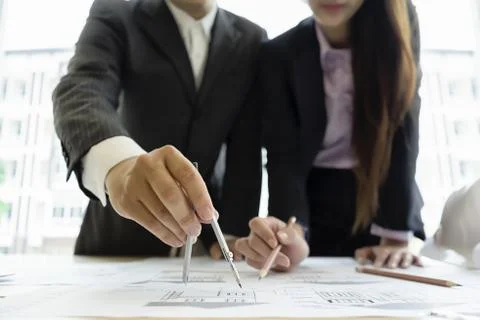 Engineer drawing architecture project on blueprint in office Foto stock