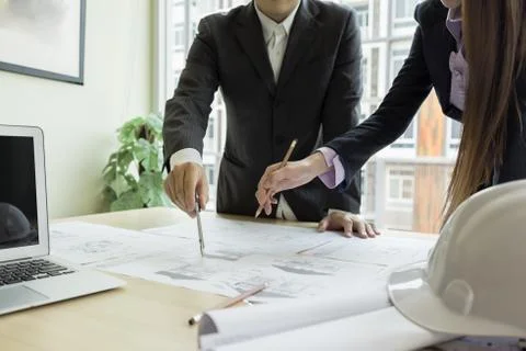 Engineer drawing architecture project on blueprint in office Foto stock