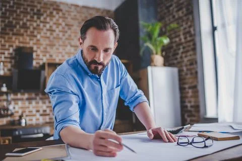 Engineer drawing building plans Stock Photos