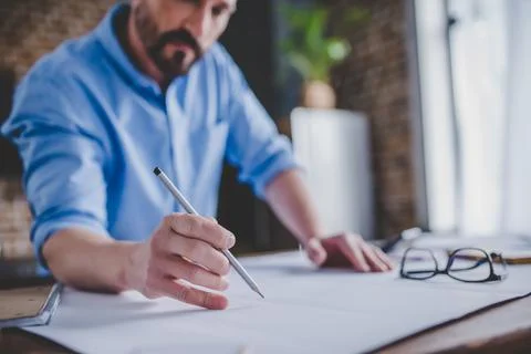 Engineer drawing building plans Stock Photos