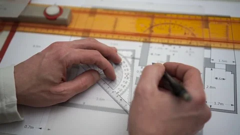 Engineer draws geometric shapes by pencil and ruler on Tracing paper Stock Footage