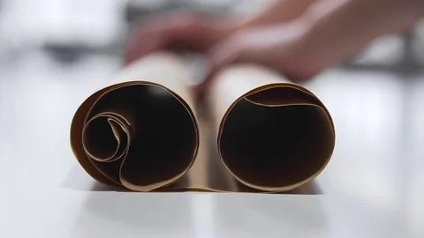 The engineer draws on a paper with a pencil, tailor makes pattern for seawing Stock Footage