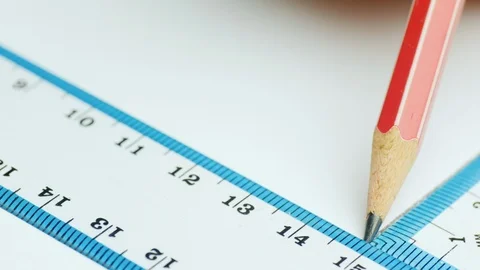 The engineer draws parallel lines in the drawing with a ruler and a triangle Stock Footage 101114714