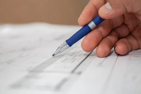 Engineer draws pencil selective focus Stock Photos