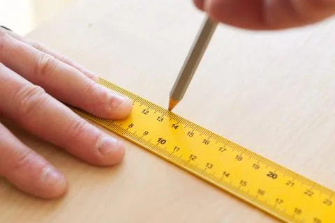.engineer draws on sheets of chipboard Stock Photos